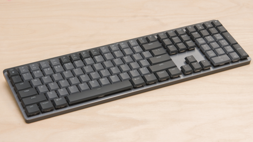 The Logitech MX Mechanical keyboard on a desk, highlighting its sleek low-profile design and backlit keys - Dealibrium